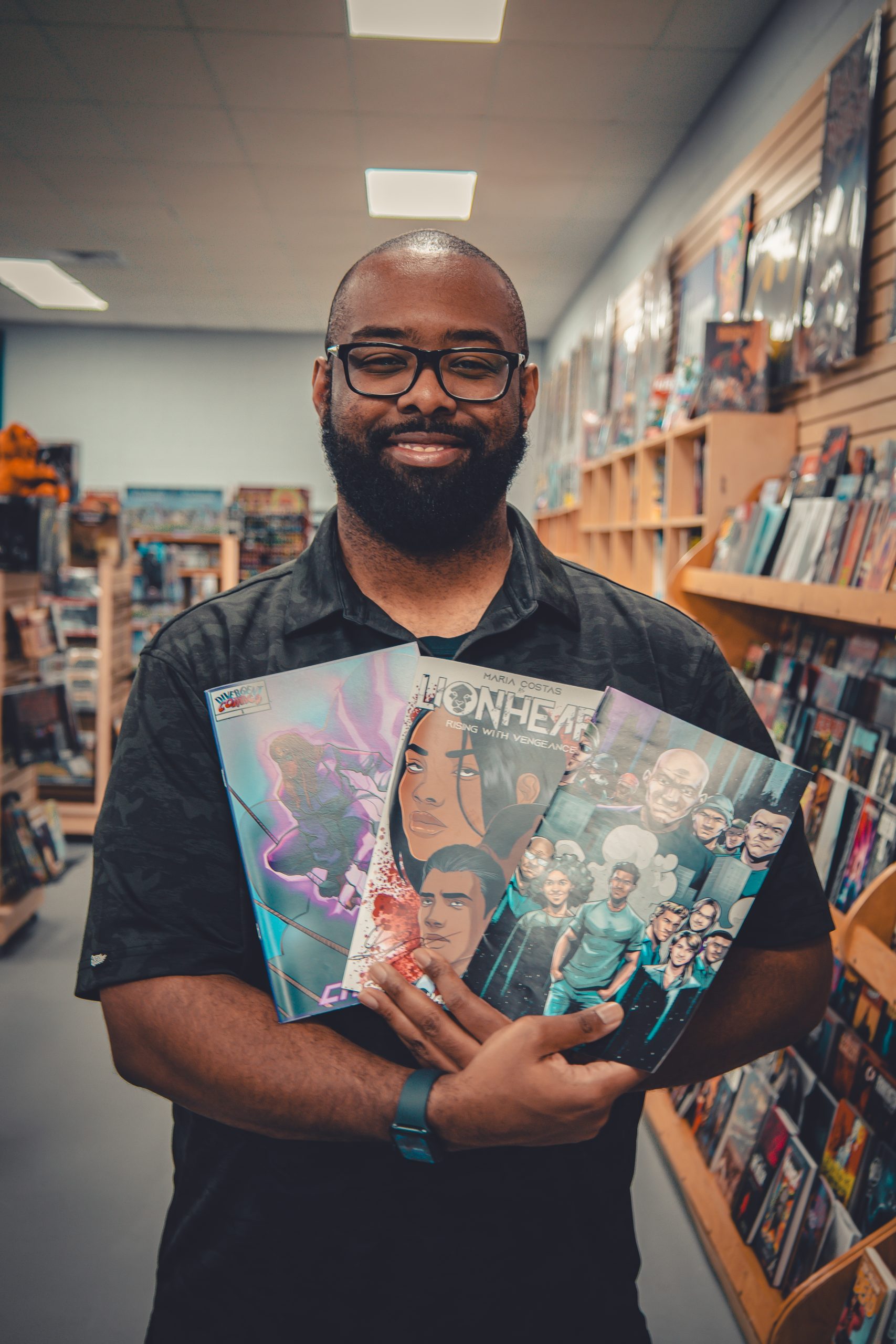 Gary Jones holding Divergent Comics